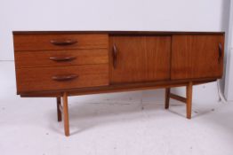 A 1970's retro teak sideboard dresser of