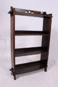 A Victorian arts & crafts oak bookcase.