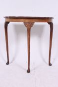 A 1930's Georgian style demi lune consol