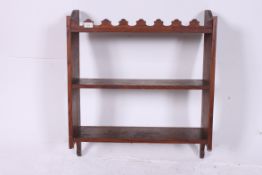 A Victorian country oak wall shelf havin