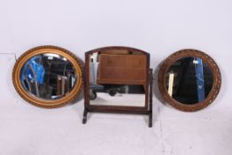 A 1950's gilt mirror of decorative form