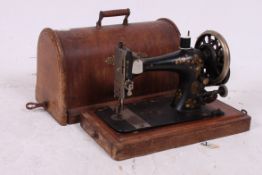 A Victorian Singer sewing matching compl