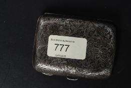 A hallmarked silver chase engraved cigar