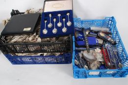 A large collection of souvenir spoons an