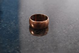 A 14ct gold band ring of plain form, wei