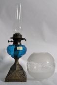 A 19th century blue glass oil lamp. The