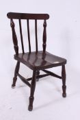 A Victorian elm seated childs chair rais