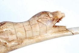 WITHDRAWN. A carved 20th century bone in