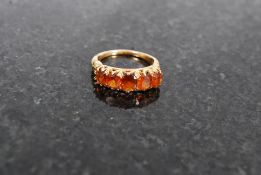 A 14k gold ladies 5 stone topaz ring. Un