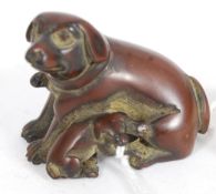 A Japanese oriental carved wood netsuke