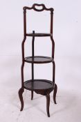 An Edwardian mahogany inlaid large 3 tie