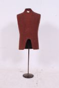A vintage shop display tailors dummy on