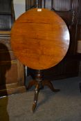 An 18th century oak tilt top tripod wine