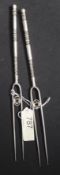 A pair of Chinese silver two pronged for