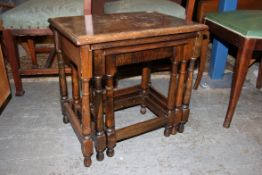 A 20th century Jacobean oak nest of tabl