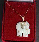 A 9ct gold and jade elephant shaped neck