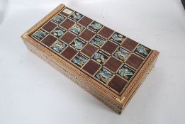 A 20th century Inlaid Islamic chess boar