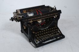 A vintage early 20th century ebonised In