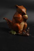 A cold painted bronze squirrel in the fo