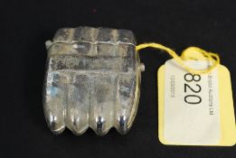 A silver plated vesta in the shape of Ha