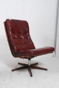 A 1970's Danish style swivel chair in th