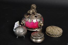 A collection of three white metal (one m