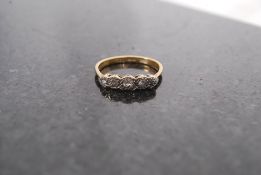 An 18ct gold and platinum ladies 5 stone