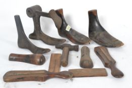 A collection of vintage wooden shoe stop