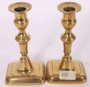 A pair of 19th century brass pusher cand