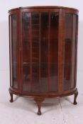A 1930's Art Deco mahogany demi lune dis