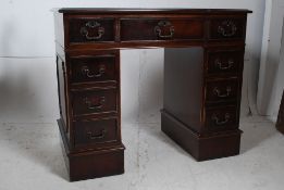 A Georgian style mahogany kneehole pedes