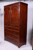 An Edwardian mahogany inlaid linen press