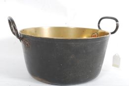 A 19th century heavy brass jam pot with