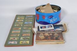 A mixed collection to include tea cards,