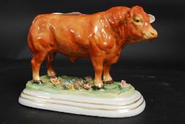 A Victorian style ceramic figure of a pr