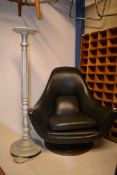 A retro 1960's faux black leather swivel