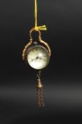 A brass cased ball clock dial stamped Om