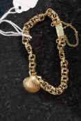 A ladies 14k / 585  gold charm bracelet