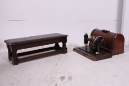 A vintage Singer sewing machine together