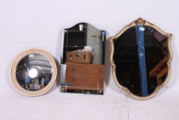 A 1950's armorial mirror, along with two