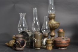 A collection of oil lamps to include bra