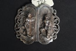 A white metal (unmarked, but likely silv