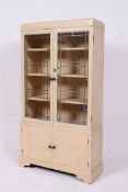 A 1930's shabby chic painted bookcase ca