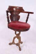 A Victorian cast iron and mahogany capta