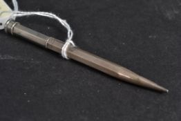 A silver hallmarked propelling pencil  b