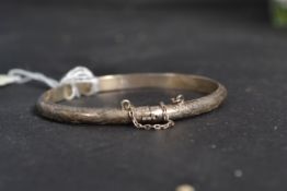 A ladies silver bracelet of simple form