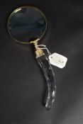 A large handheld magnifying glass
