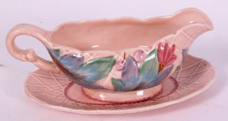 A good Clarice Cliff Sauce boat and stan