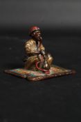 A bronze Arab Hookah smoking a pipe