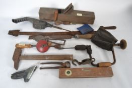 A collection of vintage tools and irons